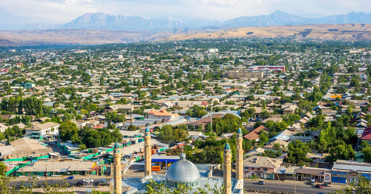 Aerial view over rooftops and mosque in Osh city, Kyrgyzstan